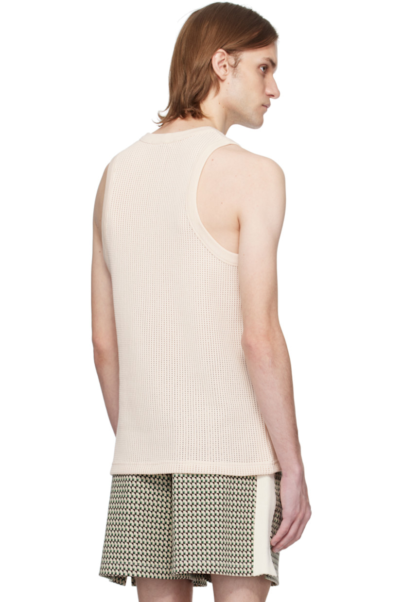 Open-knit cotton tank top. 

· Rib-knit crewneck and armscyes
· Embroidered logo patch at front hem

Supplier color: Ivory