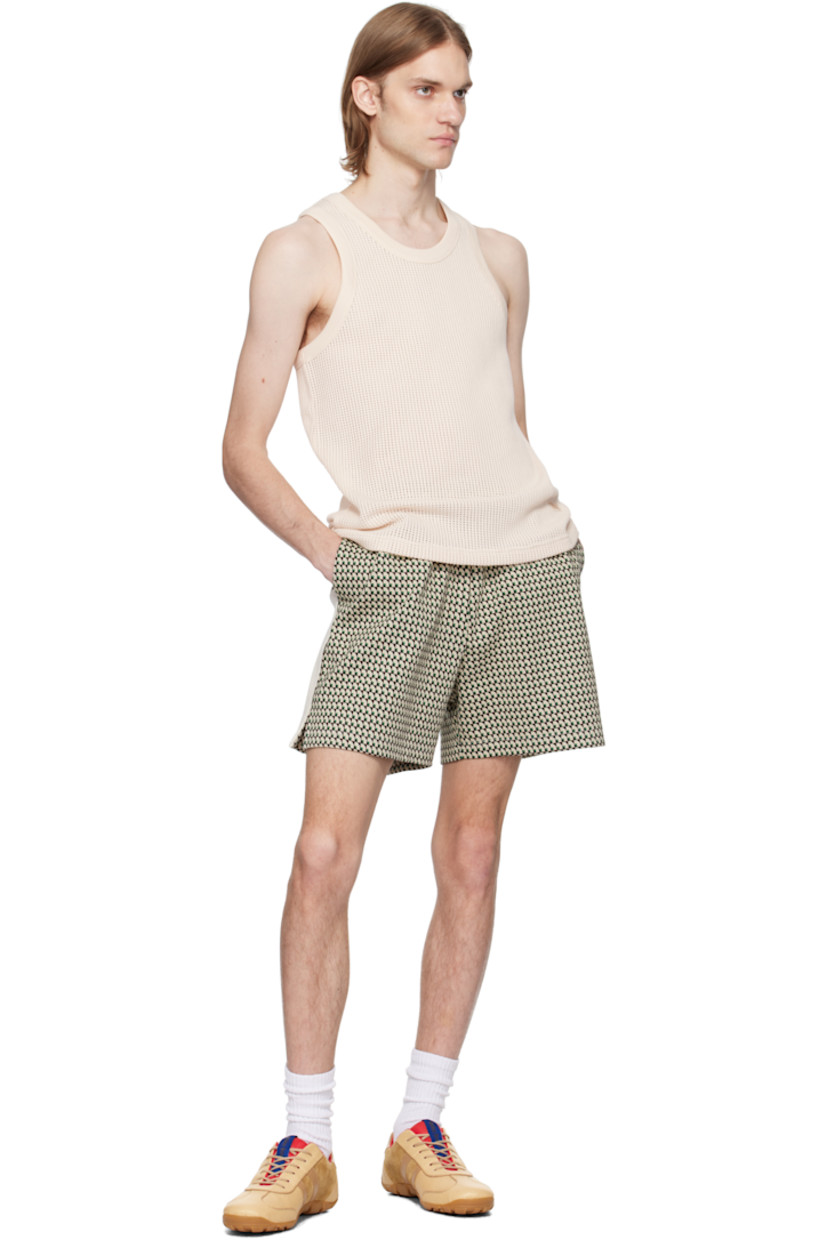 Open-knit cotton tank top. 

· Rib-knit crewneck and armscyes
· Embroidered logo patch at front hem

Supplier color: Ivory