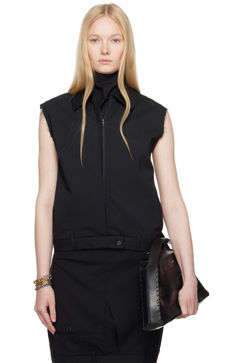 Stretch polyester- and wool-blend twill vest.

· Spread collar
· Concealed zip closure
· Welt pockets
· Button tab and belt loops at hem
· Raw edge at armscyes
· Welt pockets at back
· Partial satin lining

Each item is constructed using upcycled garments. Please note colorways may vary.