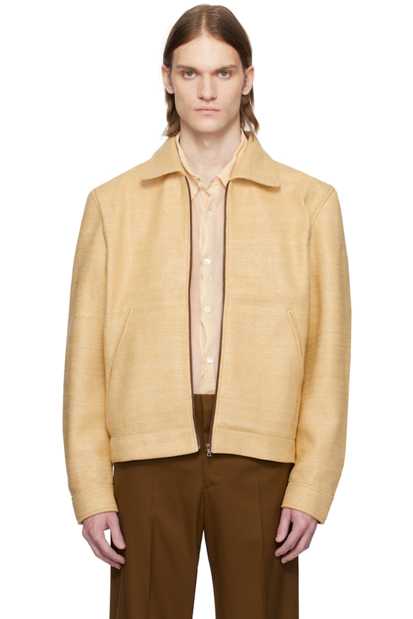 Basket-woven polyester jacket.

· Spread collar
· Zip closure
· Welt pockets
· Buttoned barrel cuffs
· Leather logo patch at back collar
· Unlined

Supplier color: Natural
