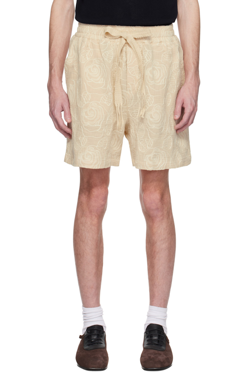 Relaxed-fit plain-woven polyester-blend shorts. Floral pattern embroidered throughout.

· Fringed drawstring at elasticized waistband
· Three-pocket styling

Supplier color: White rose