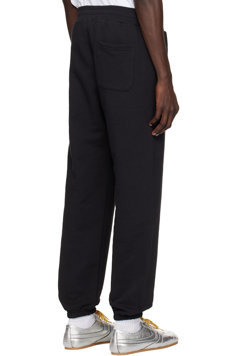 French terry sweatpants.

· Oversized
· Drawstring at waistband
· Three-pocket styling
· Elasticized cuffs

Supplier color: Black