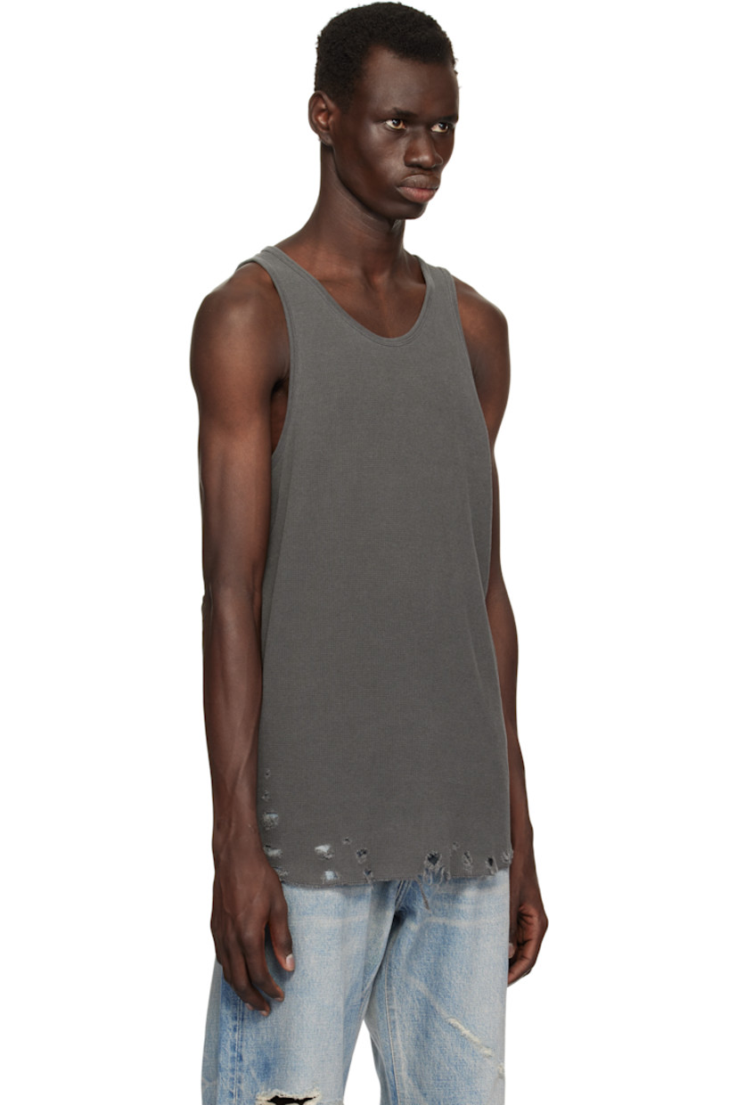 Waffle-knit cotton tank top.

· Rib-knit scoop neck and armscyes
· Rips at curved hem
· Flatlock stitching at side seams and back

Supplier color: Vintage black