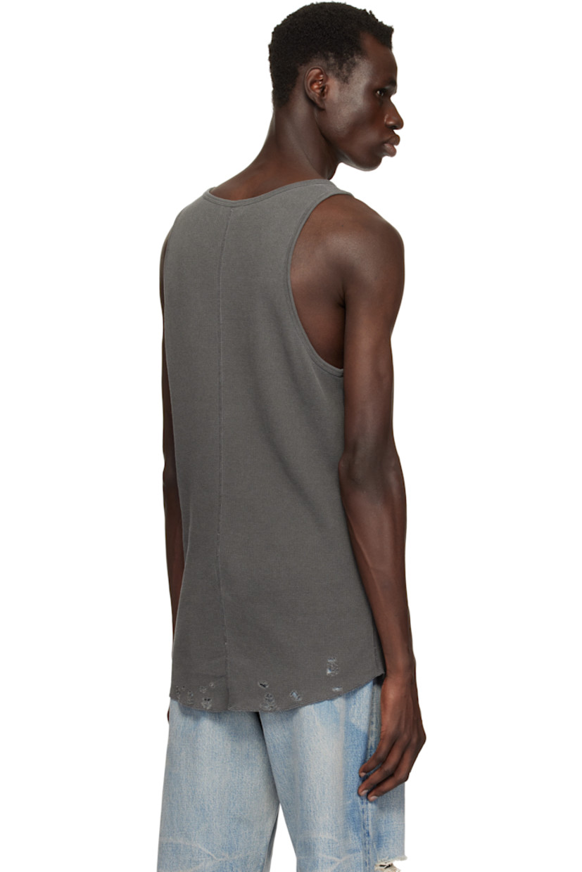 Waffle-knit cotton tank top.

· Rib-knit scoop neck and armscyes
· Rips at curved hem
· Flatlock stitching at side seams and back

Supplier color: Vintage black