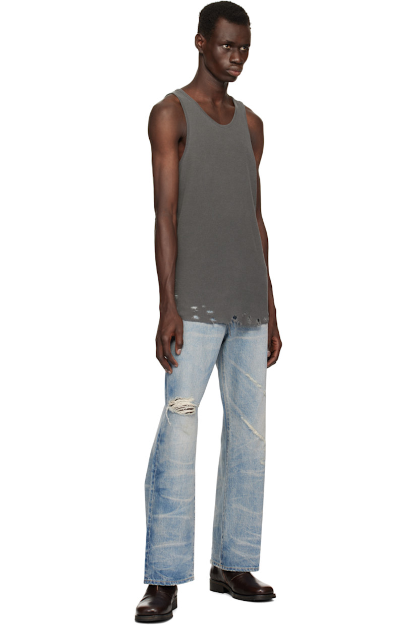 Waffle-knit cotton tank top.

· Rib-knit scoop neck and armscyes
· Rips at curved hem
· Flatlock stitching at side seams and back

Supplier color: Vintage black