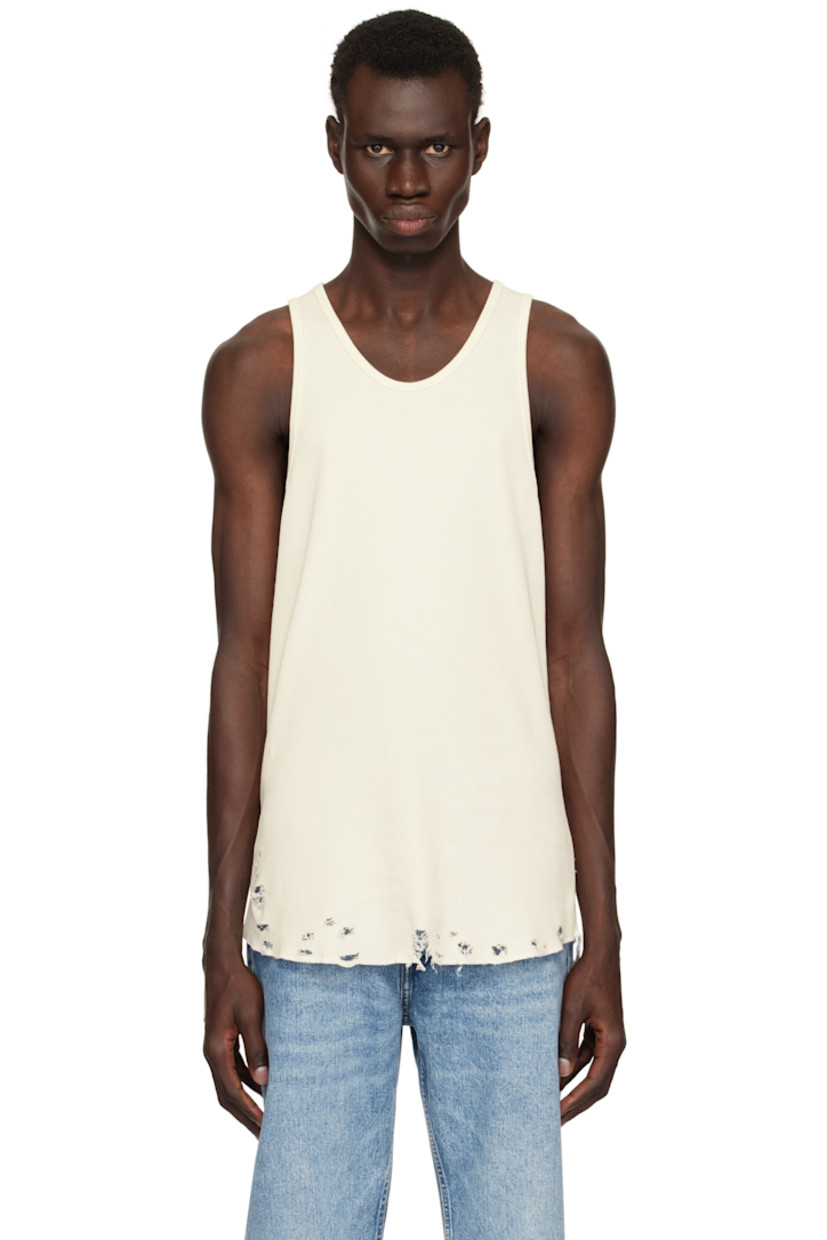 Waffle-knit cotton tank top.

· Rib-knit scoop neck and armscyes
· Rips at curved hem
· Flatlock stitching at side seams and back

Supplier color: Vintage white