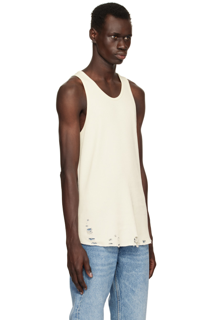Waffle-knit cotton tank top.

· Rib-knit scoop neck and armscyes
· Rips at curved hem
· Flatlock stitching at side seams and back

Supplier color: Vintage white