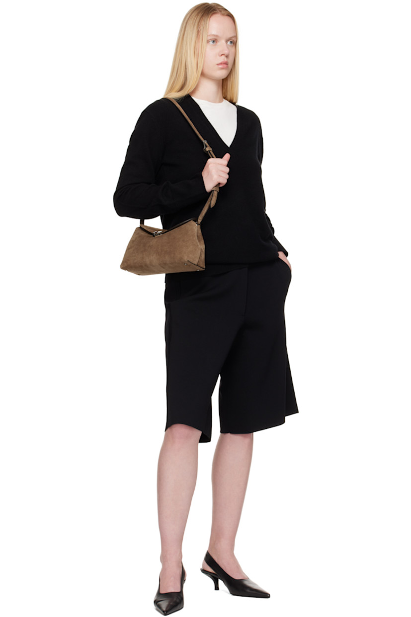LWG-certified suede clutch.

· Adjustable and detachable shoulder strap
· Bumper studs at base
· Turn-lock flap closure
· Card slot at interior
· Logo-engraved silver-tone hardware
· H5.5" x W10.25" x D3.5"

Supplier color: Tobacco