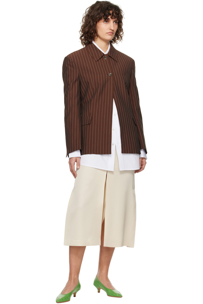 Plain-woven viscose- and lyocell-blend jacket. Pinstripes throughout. 

· Spread collar
· Button closure
· Darts at front
· Flap pockets
· Padded shoulders
· Vented cuffs
· Central vent at back hem
· Partially lined

Supplier color: Red brown