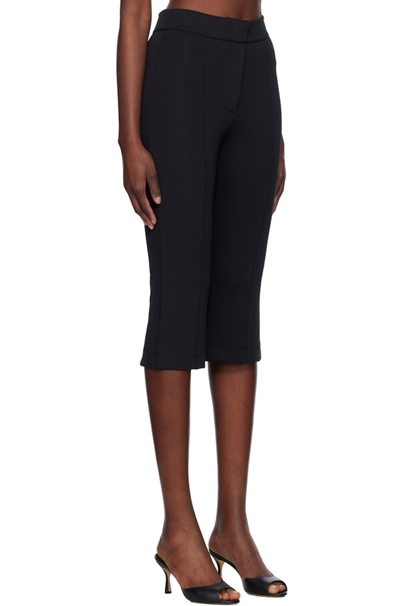 Stretch nylon jersey trousers. 

· Paneled construction
· Zip fly
· Pintuck at legs
· Vent at back cuffs

Supplier color: Black
