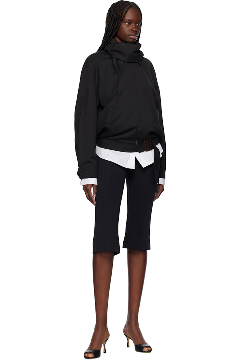 Stretch nylon jersey trousers. 

· Paneled construction
· Zip fly
· Pintuck at legs
· Vent at back cuffs

Supplier color: Black