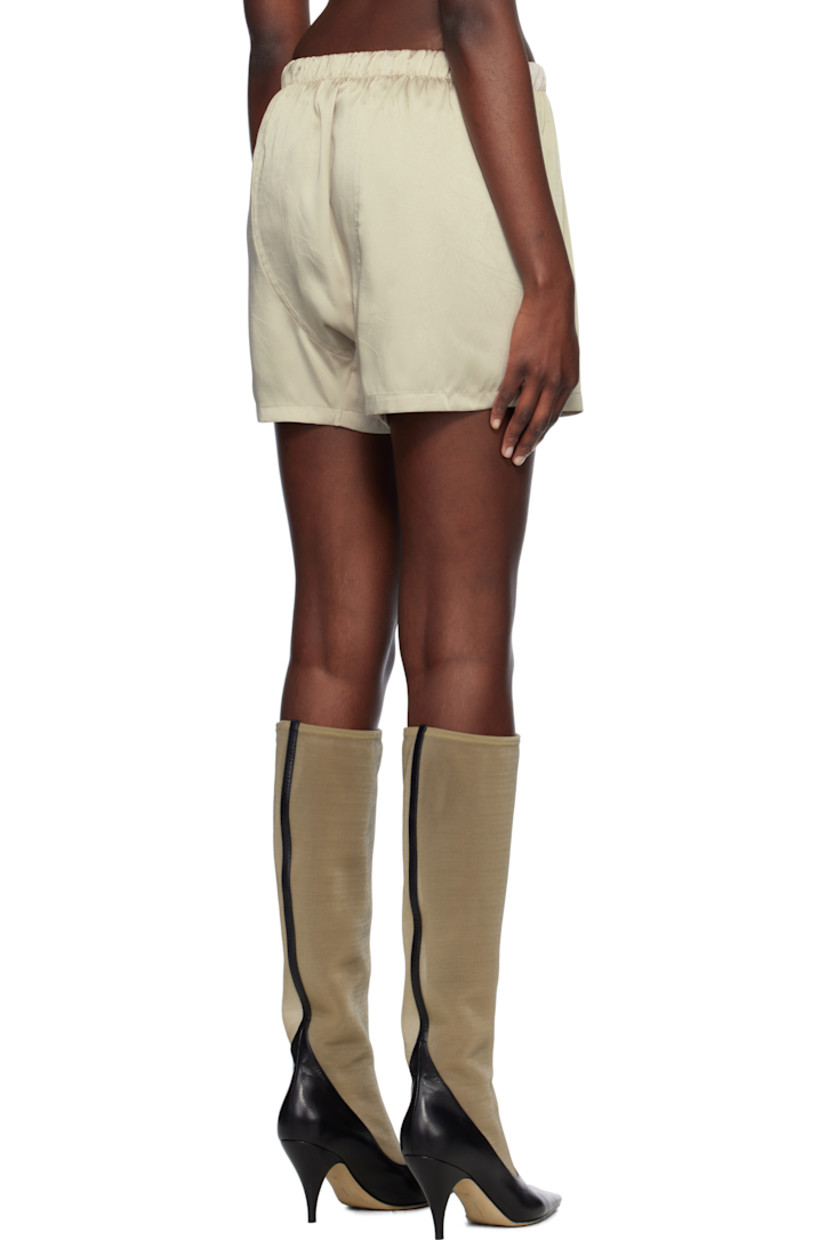 Crinkled polyester satin shorts.

· Elasticized waistband
· Logo patch at mock fly
· Partially lined

Supplier color: Sepia beige