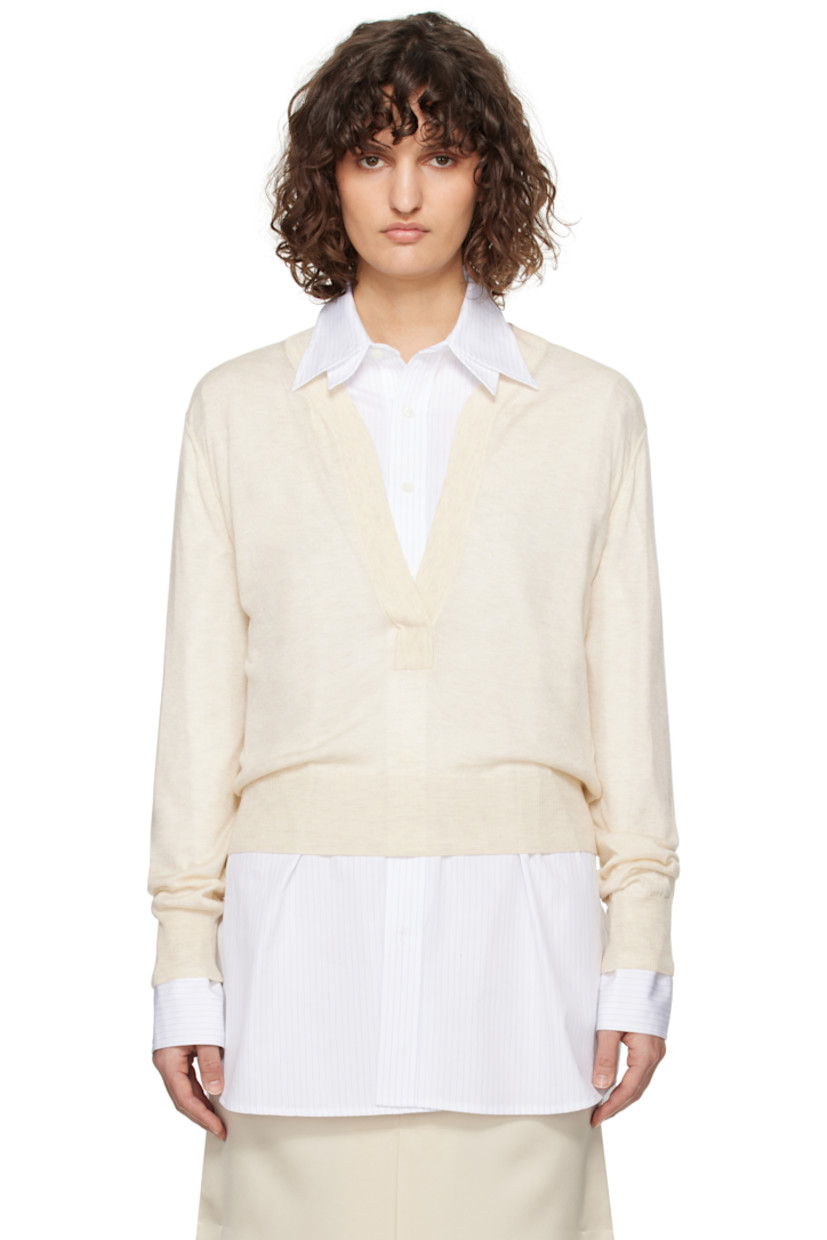 Semi-sheer knit acrylic- and tencel-blend sweater. 

· Rib-knit plunging V-neck, hem, and cuffs
· Dropped shoulders
· Central seam at back

Supplier color: Ivory