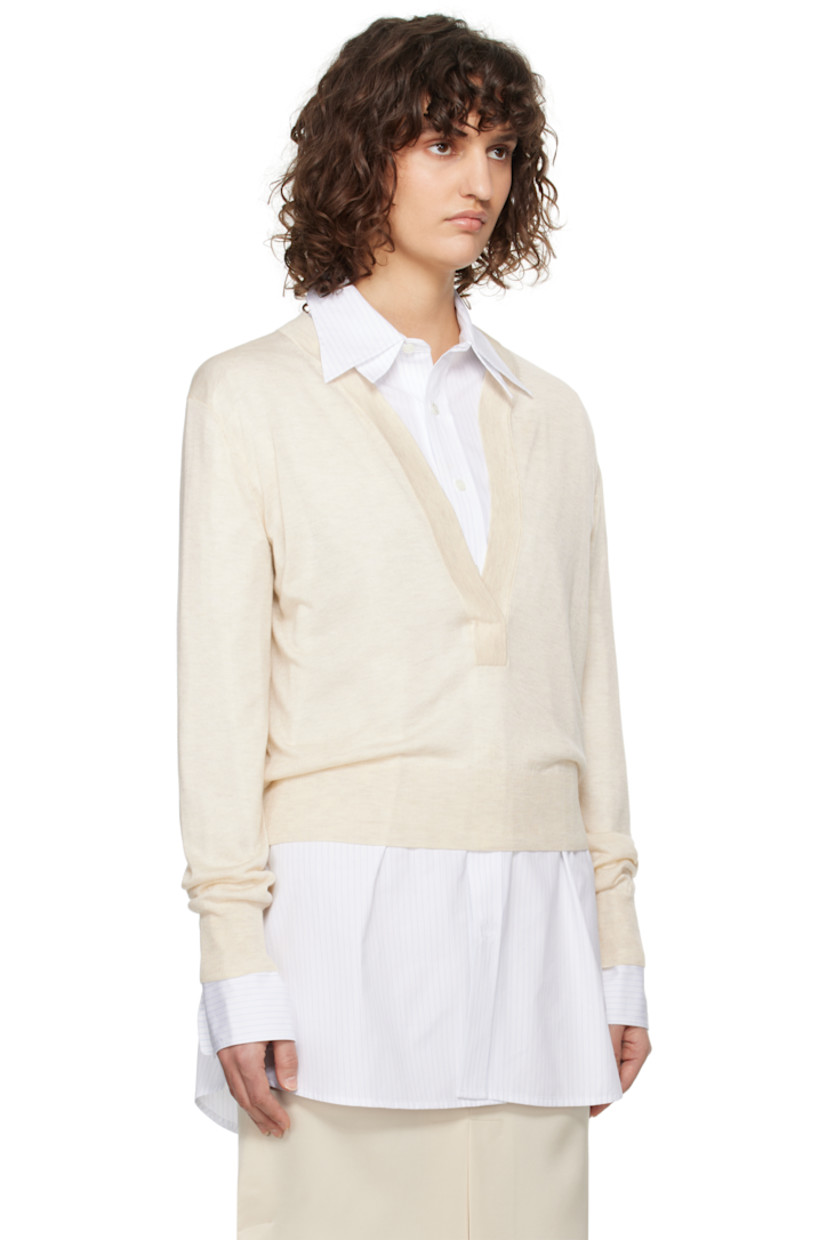 Semi-sheer knit acrylic- and tencel-blend sweater. 

· Rib-knit plunging V-neck, hem, and cuffs
· Dropped shoulders
· Central seam at back

Supplier color: Ivory