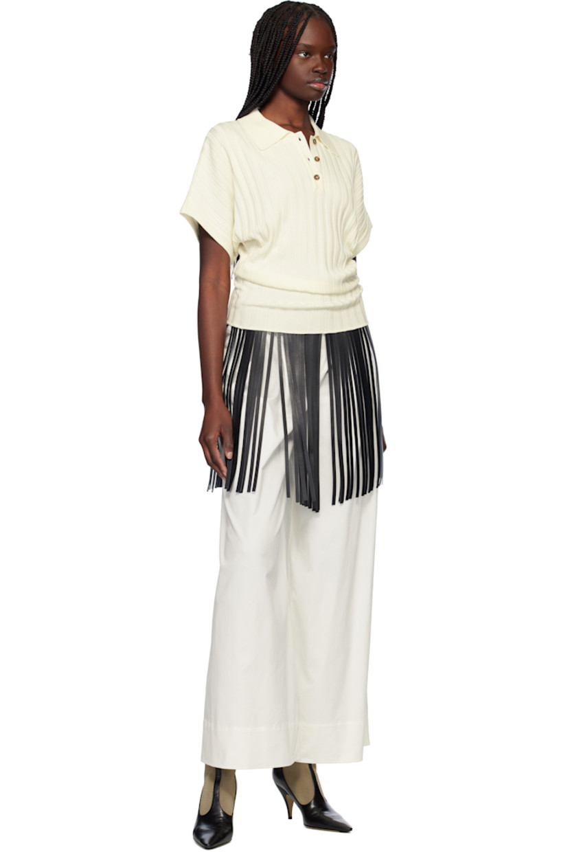 Rib-knit viscose-blend polo.

· Spread collar
· Three-button placket
· Dolman sleeves
· Horn hardware

Supplier color: Ivory
