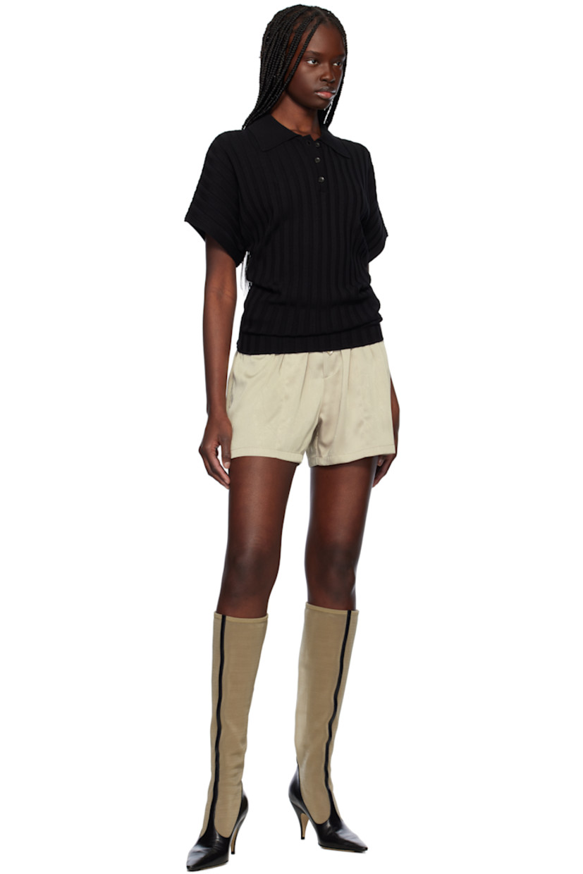 Rib-knit viscose-blend polo.

· Spread collar
· Three-button placket
· Dolman sleeves
· Horn hardware

Supplier color: Black