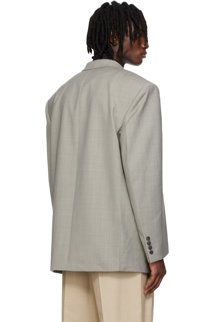 Oversized plain-woven polyester-and wool-blend blazer.

· Notched lapel
· Button closure
· Welt pocket and flap pockets
· Darts at front 
· Padded shoulders
· Surgeon's cuffs
· Welt pocket at interior
· Full satin lining
· Horn hardware

Supplier color: Charcoal grey