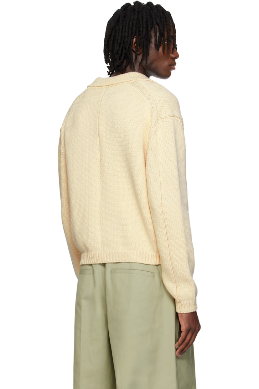 Knit cotton cardigan.

· Spread collar
· Zip closure
· Patch pockets
· Rib-knit hem and cuffs
· Dropped shoulders

Supplier color: Cream