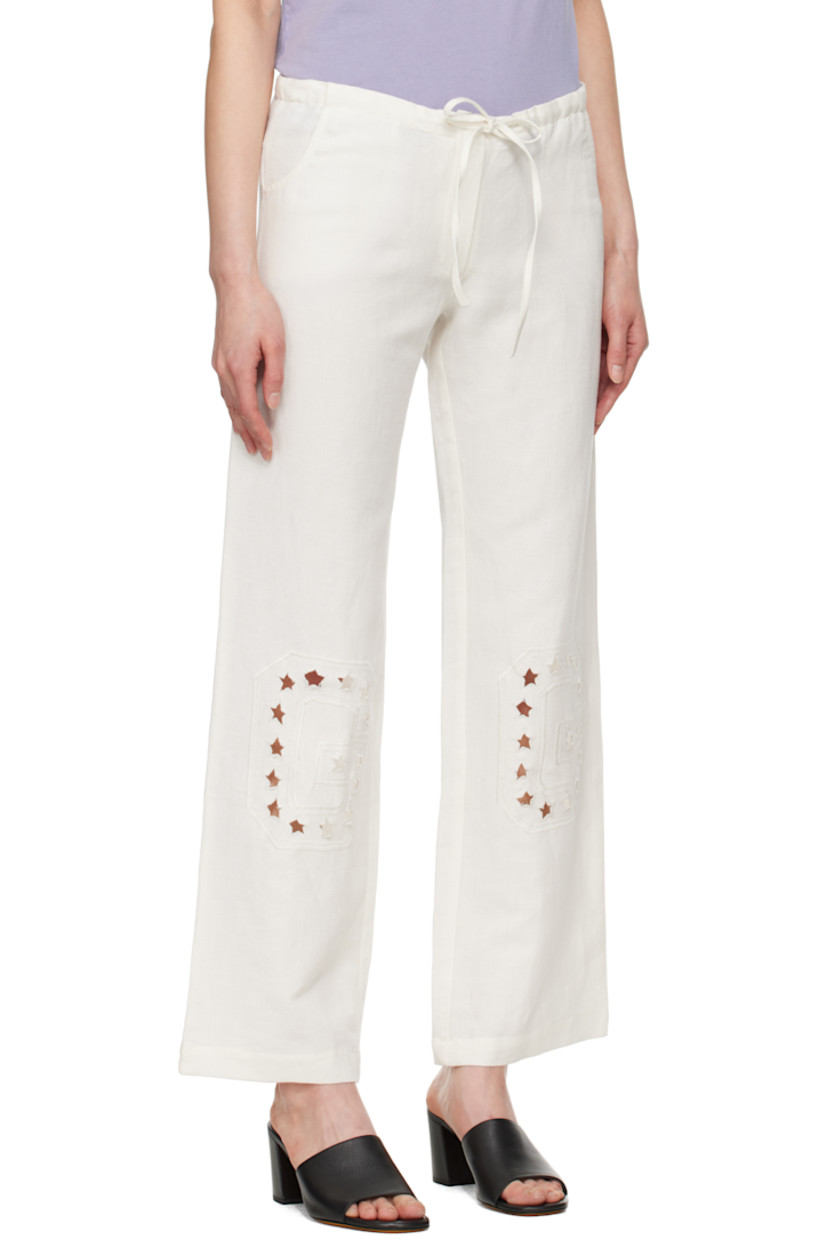 Plain-woven linen- and cotton-blend lounge pants. 

· Drawstring at waistband 
· Two-pocket styling 
· Zip fly 
· Graphic cutouts and embroidered logo at knees

Supplier color: White