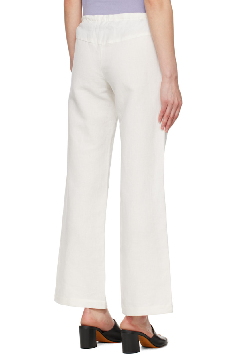 Plain-woven linen- and cotton-blend lounge pants. 

· Drawstring at waistband 
· Two-pocket styling 
· Zip fly 
· Graphic cutouts and embroidered logo at knees

Supplier color: White