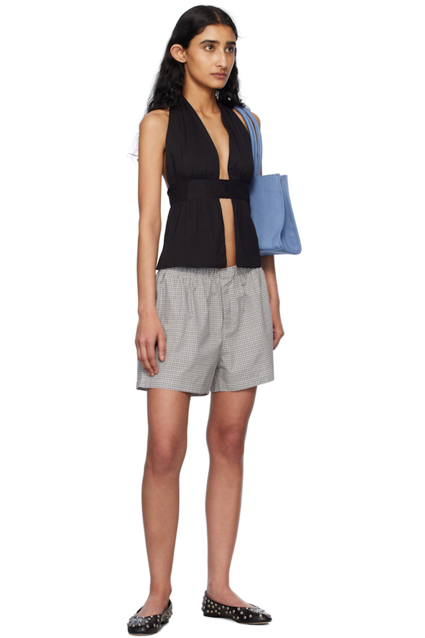 Cotton poplin shorts. Check pattern throughout.

· Elasticized waistband
· Button fly
· Logo embroidered at front hem 

Supplier color: Black/White