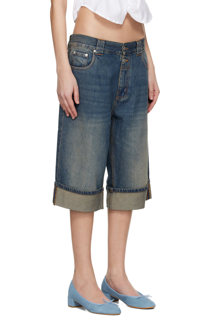 Non-stretch cotton- and lyocel-blend denim shorts. Fading and whiskering throughout.

· Low-rise
· Belt loops
· Five-pocket styling
· Zip fly
· Rolled cuffs
· Silver-tone hardware
· Contrast stitching in tan

Supplier color: Blue