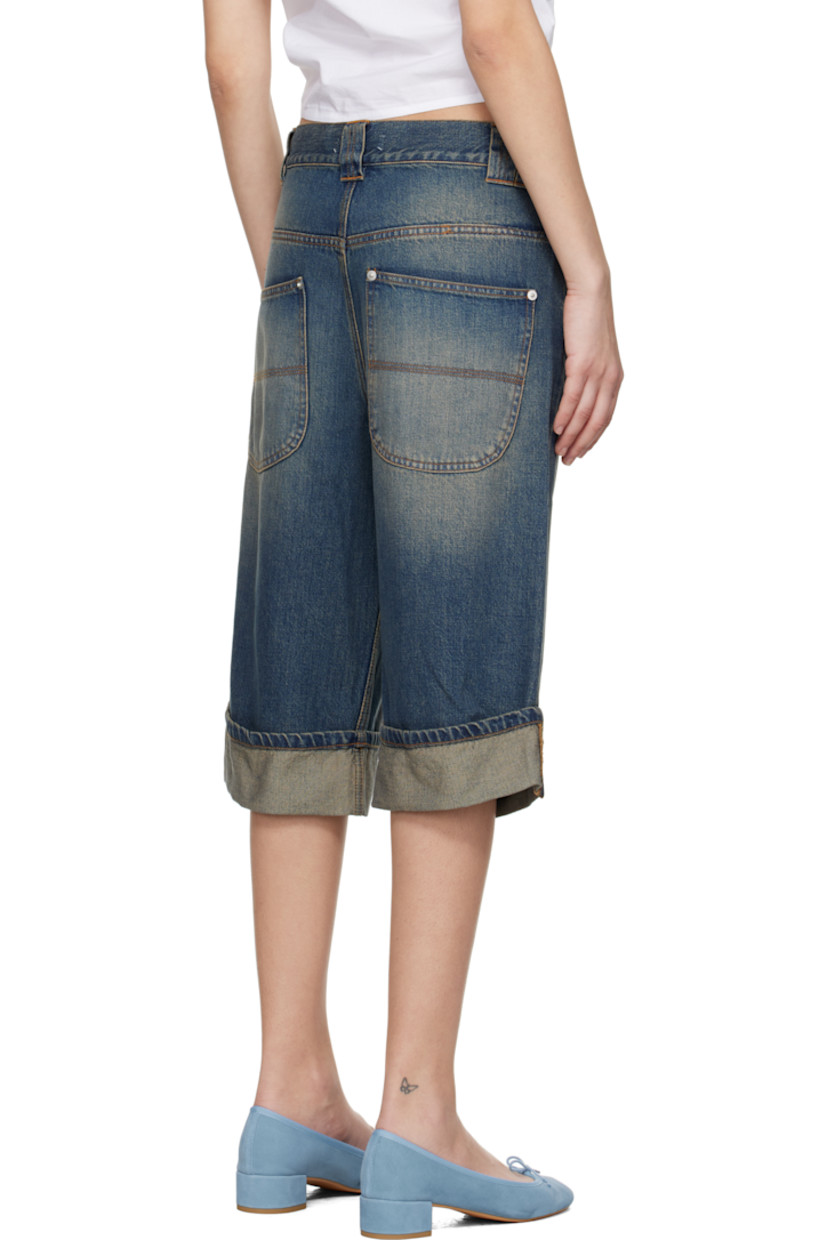 Non-stretch cotton- and lyocel-blend denim shorts. Fading and whiskering throughout.

· Low-rise
· Belt loops
· Five-pocket styling
· Zip fly
· Rolled cuffs
· Silver-tone hardware
· Contrast stitching in tan

Supplier color: Blue