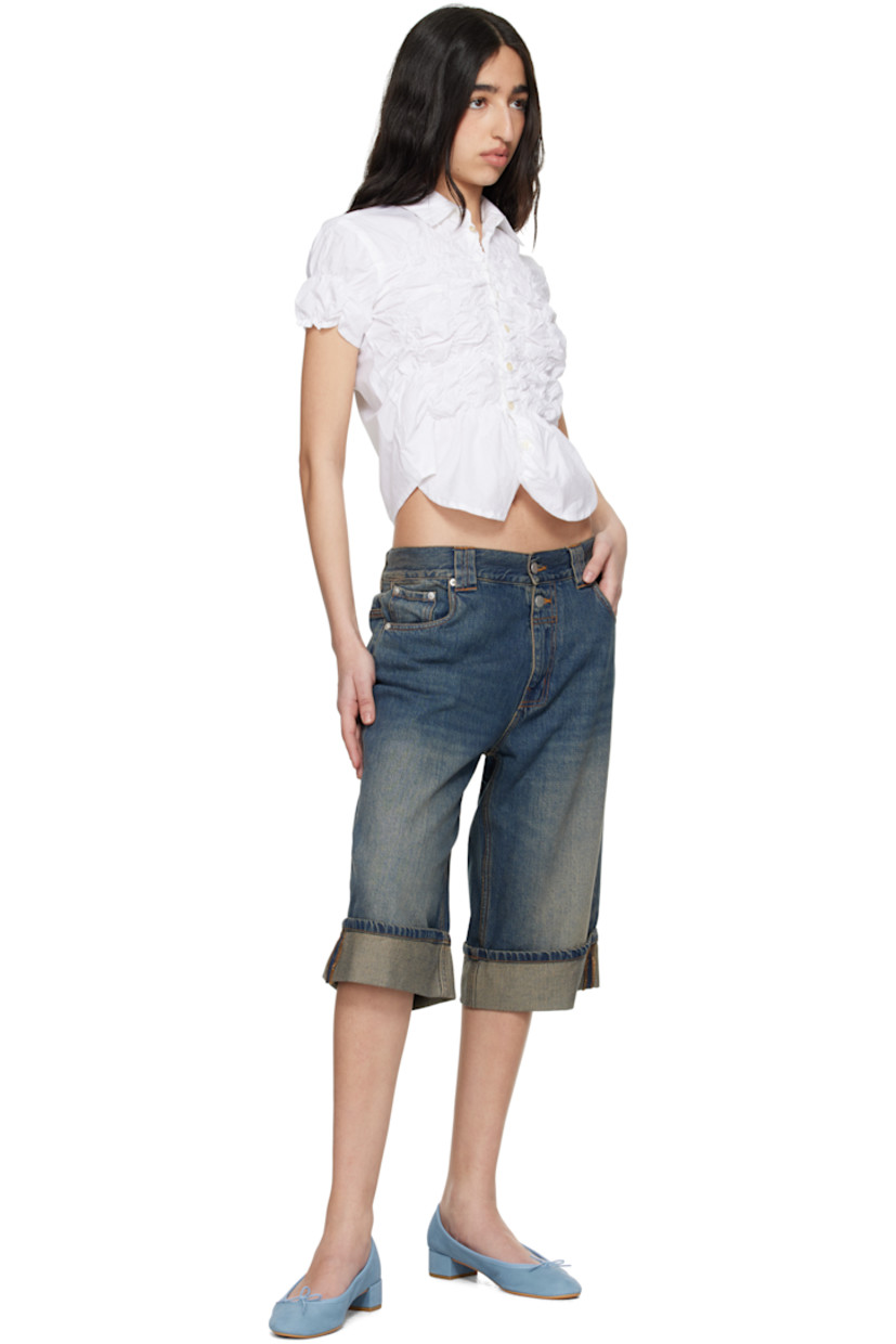 Non-stretch cotton- and lyocel-blend denim shorts. Fading and whiskering throughout.

· Low-rise
· Belt loops
· Five-pocket styling
· Zip fly
· Rolled cuffs
· Silver-tone hardware
· Contrast stitching in tan

Supplier color: Blue