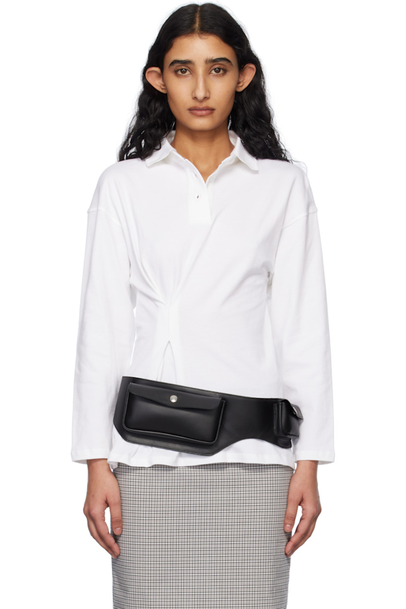 Stretch cotton piqué polo. 

· Rib-knit spread collar
· Three-button placket
· Offset pleat at front 
· Dropped shoulders

Supplier color: White