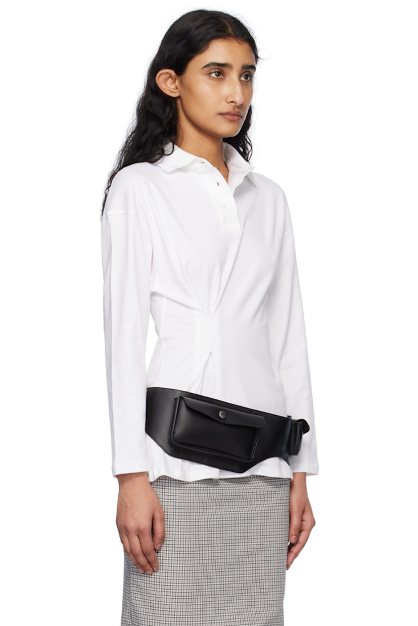 Stretch cotton piqué polo. 

· Rib-knit spread collar
· Three-button placket
· Offset pleat at front 
· Dropped shoulders

Supplier color: White