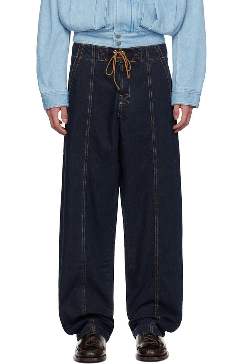 Non-stretch denim jeans. 

· Lace-up closure at waistband
· Four-pocket styling
· Zip-fly
· Central seams at front and back 
· Contrast stitching in tan

Supplier color: Navy
