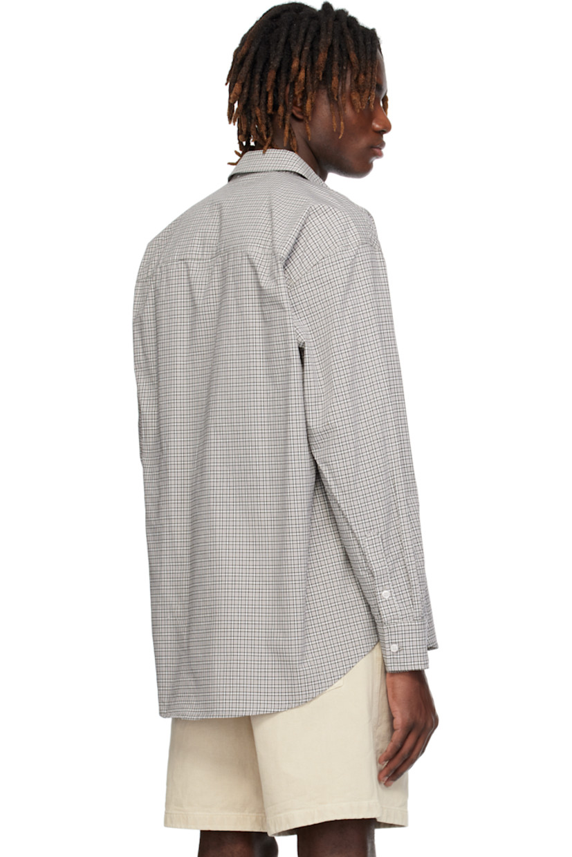 Cotton poplin shirt. Check pattern throughout. 

· Spread collar
· Button closure
· Shirttail hem
· Dropped shoulders
· Single-button barrel cuffs

Supplier color: Grey