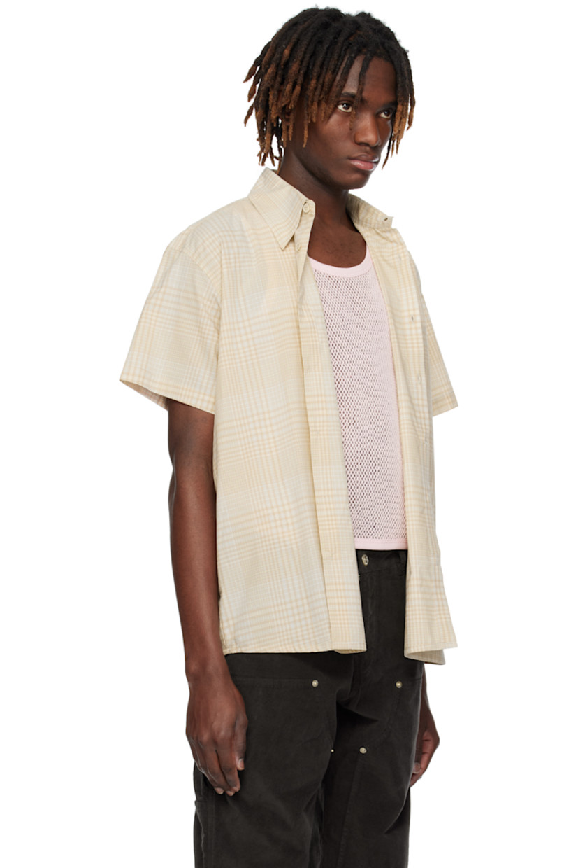 Plain-woven cotton shirt. Check pattern throughout. 

· Spread collar
· Button closure
· Shirttail hem
· Twin pleats at back yoke

Supplier color: Brown