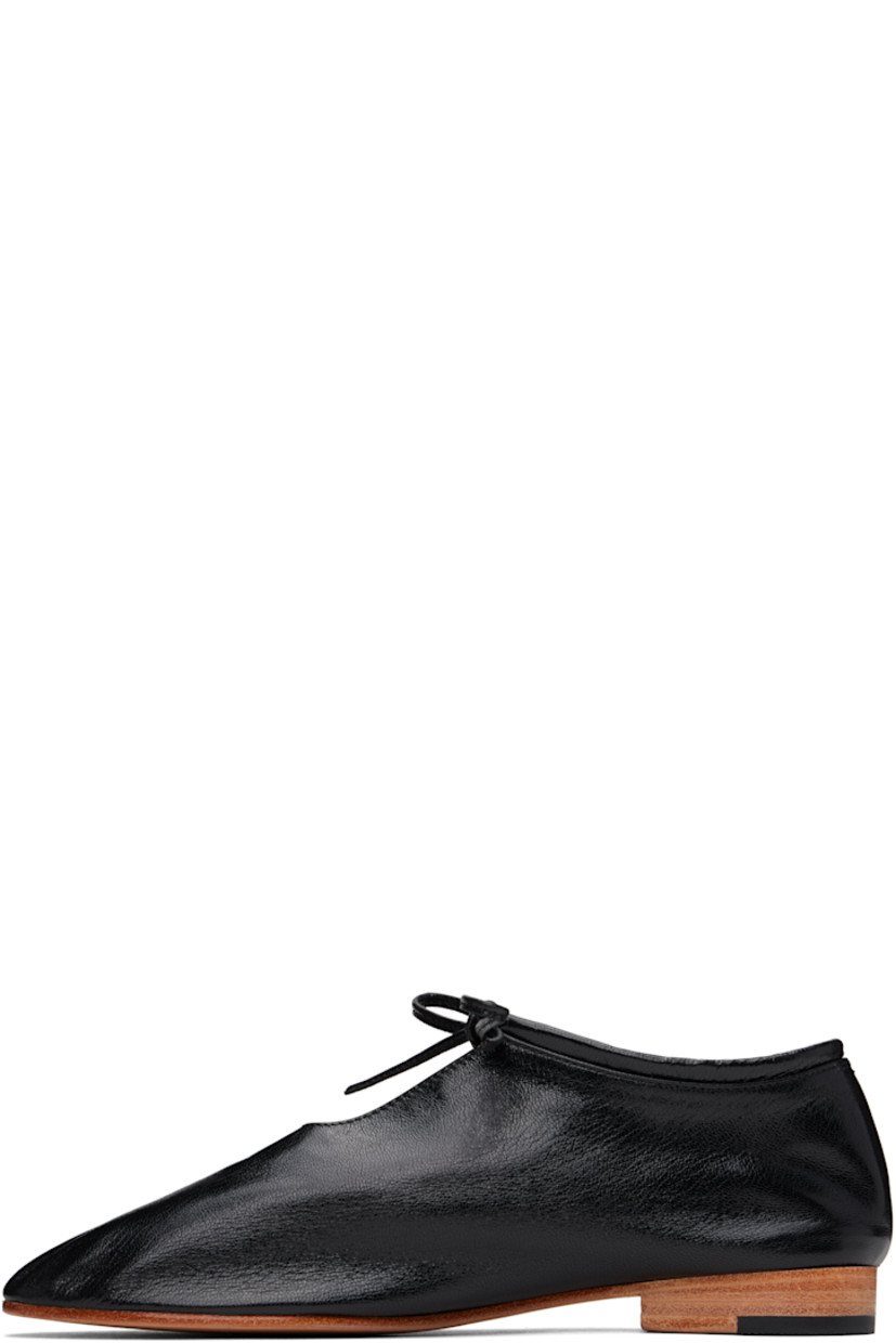 Handcrafted grained kidskin loafers in black.

· Self-tie closure
· Grained kidskin and suede lining
· Stacked leather heel with rubber injection
· Leather sole

Supplier color: Black