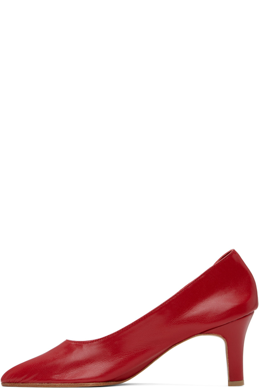 Handcrafted grained kidskin heels in red.

· Pointed toe
· Grained kidskin and suede lining
· Covered heel with rubber injection
· Leather sole
· Heel: H2.75"

Supplier color: Red