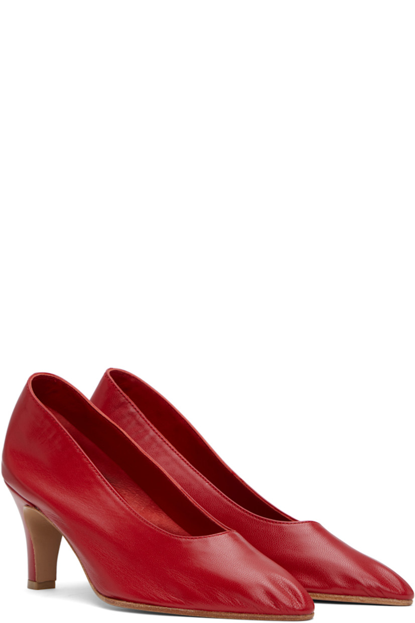 Handcrafted grained kidskin heels in red.

· Pointed toe
· Grained kidskin and suede lining
· Covered heel with rubber injection
· Leather sole
· Heel: H2.75"

Supplier color: Red