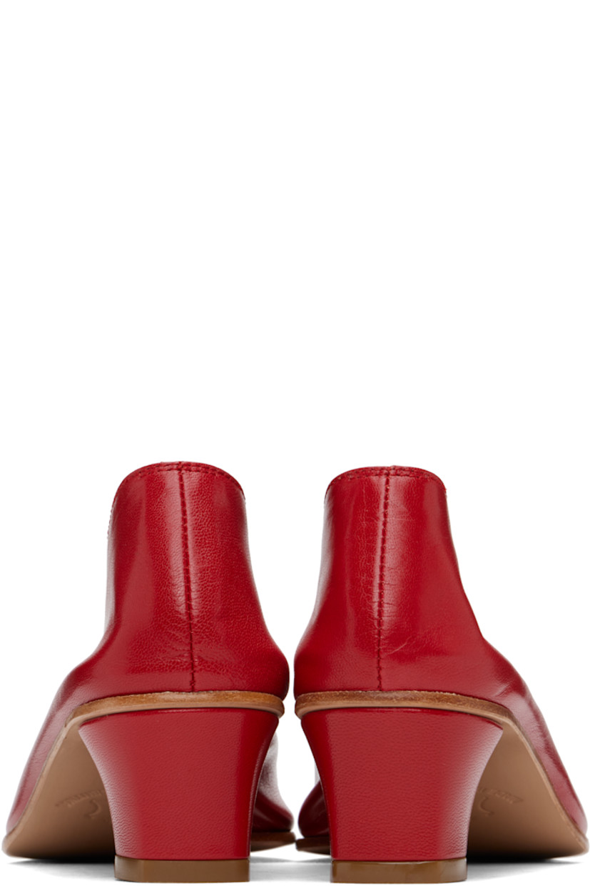 Handcrafted grained kidskin heels in red.

· Grained kidskin and suede lining
· Covered block heel with rubber injection
· Leather sole
· Heel: H1.75"

Supplier color: Red