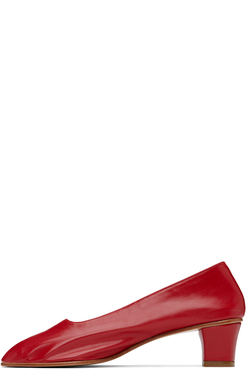 Handcrafted grained kidskin heels in red.

· Grained kidskin and suede lining
· Covered block heel with rubber injection
· Leather sole
· Heel: H1.75"

Supplier color: Red