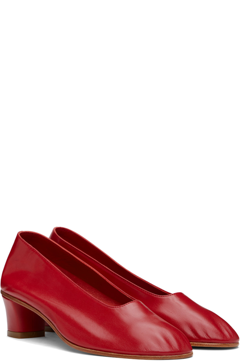 Handcrafted grained kidskin heels in red.

· Grained kidskin and suede lining
· Covered block heel with rubber injection
· Leather sole
· Heel: H1.75"

Supplier color: Red