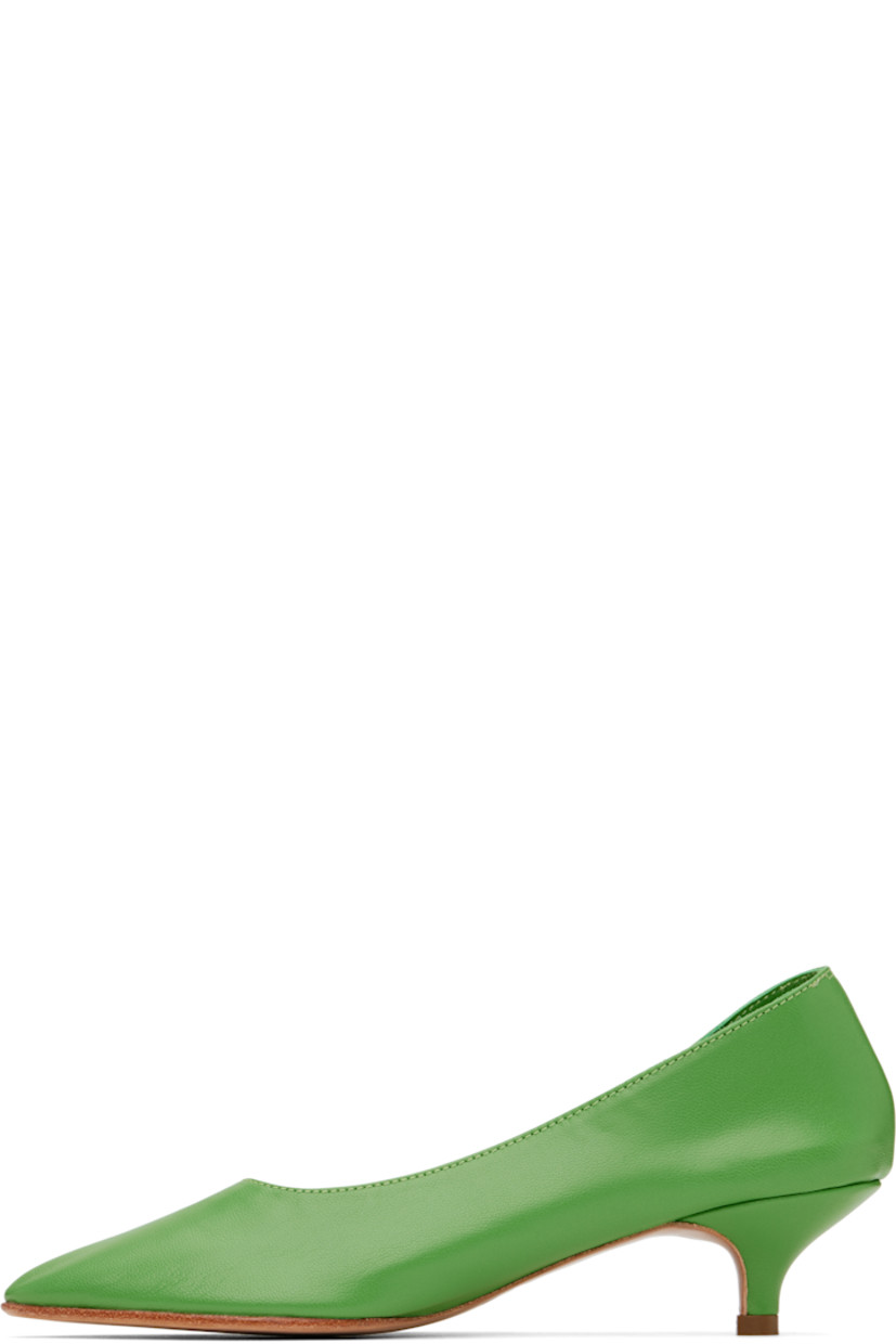 Handcrafted grained kidskin heels in green.

· Pointed toe
· Grained kidskin and suede lining
· Covered kitten heel with rubber injection
· Leather sole
· Heel: H1.75"

Supplier color: Bamboo
