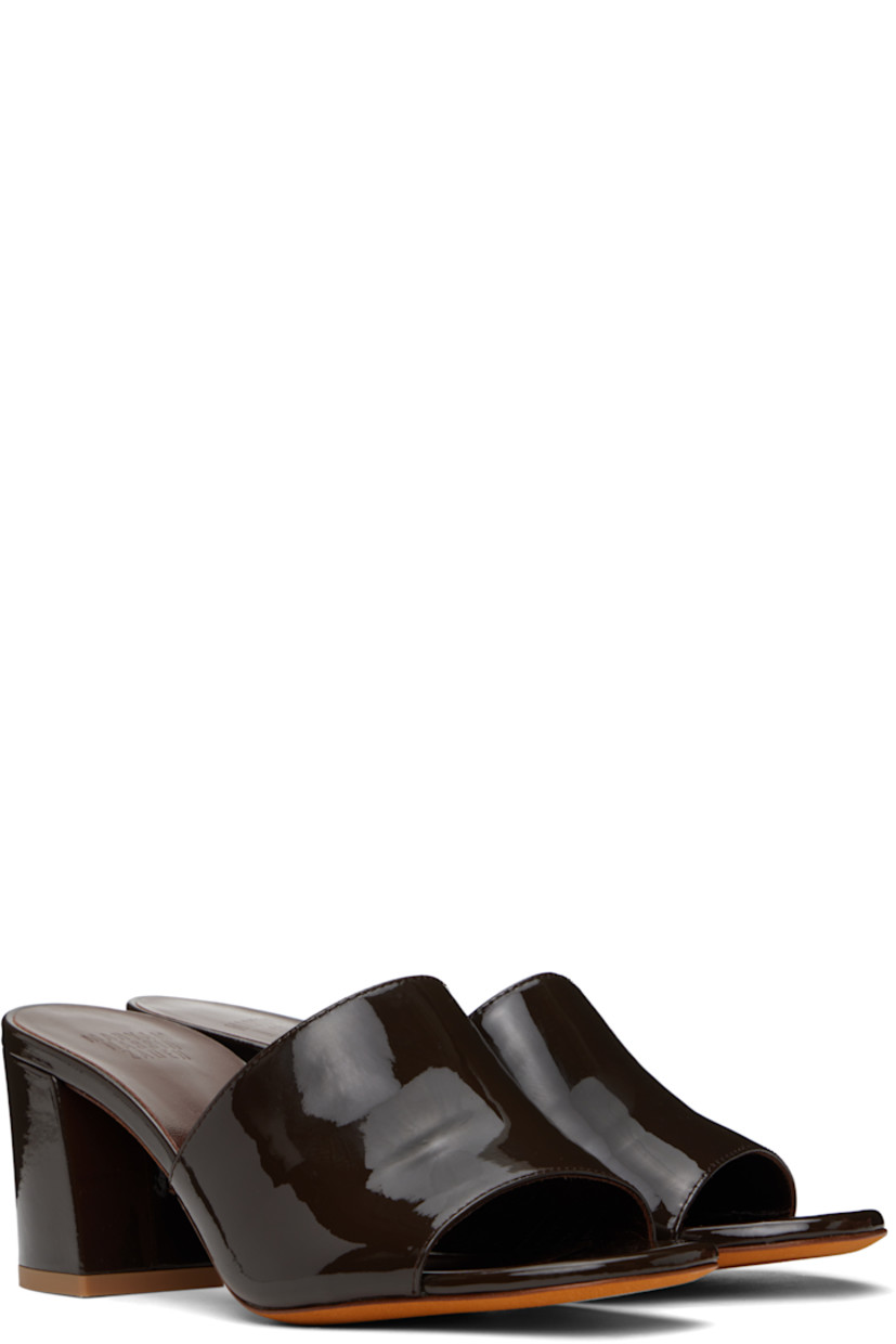 Patent calfskin heeled sandals in brown.

· Open toe
· Logo embossed at padded leather footbed
· Covered block heel with rubber injection
· Nubuck sole
· Heel: H2.5"

Supplier color: Carob