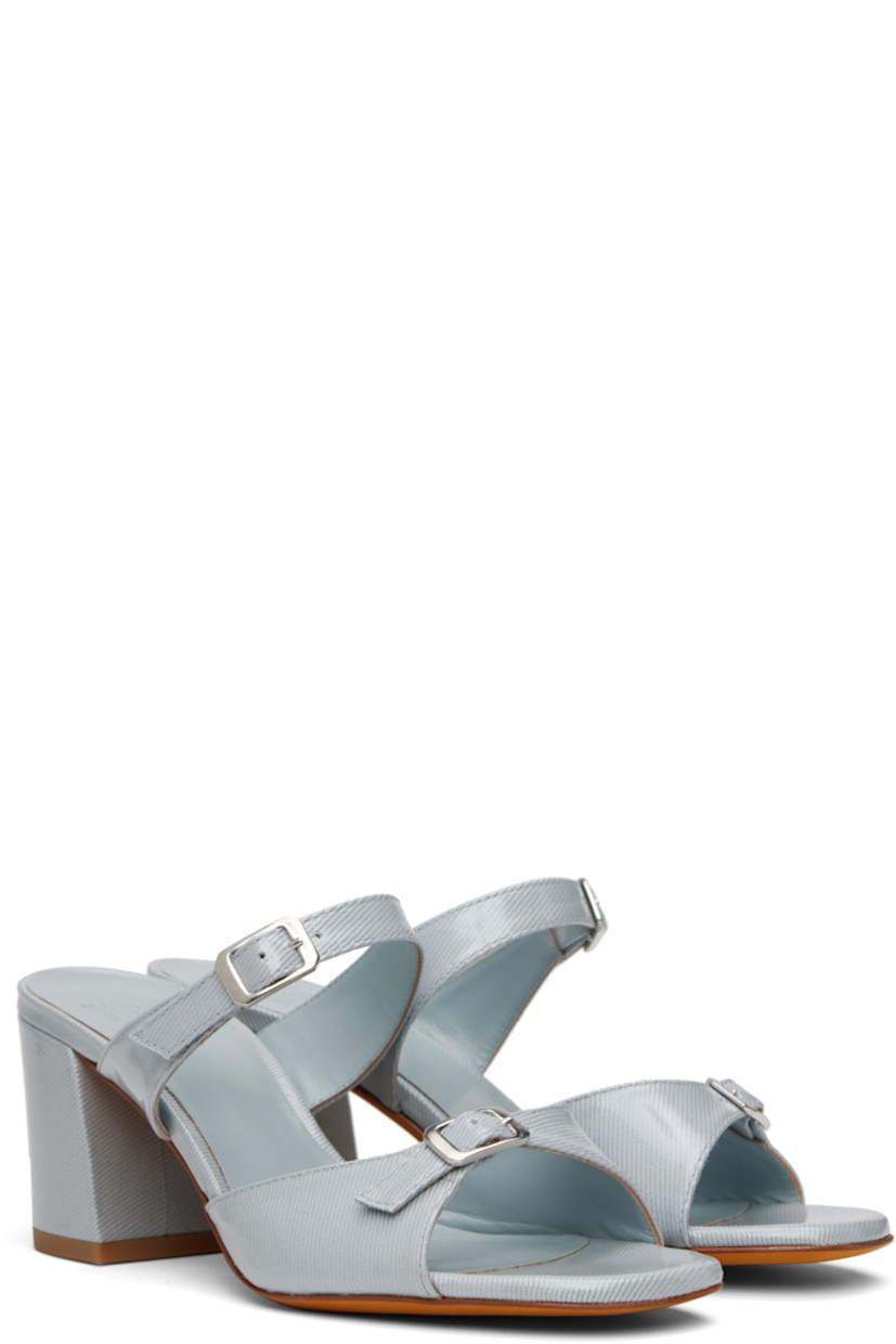Coated denim heeled sandals.

· Open square toe
· Pin-buckle straps at vamp
· Logo embossed at padded footbed
· Covered block heel with rubber injection
· Nubuck sole
· Heel: H2.75"

Supplier color: Ouran fabric