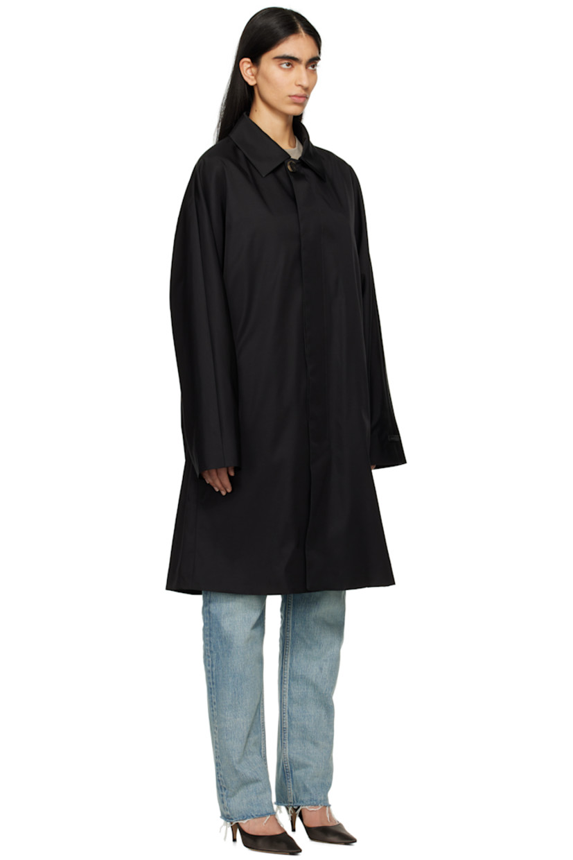 Loose-fit nylon- and wool-blend twill coat.

· Spread collar
· Concealed button closure
· Seam pockets
· Rubberized logo patch at cuff
· Locker loop at back collar
· Welt pocket at interior
· Partial sateen and twill lining
· Logo-engraved horn hardware

Part of the Eternal collection.

Supplier color: Black