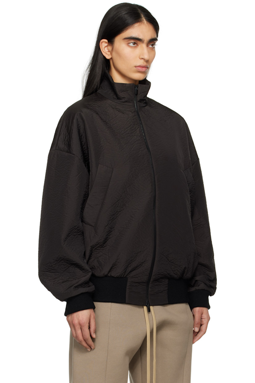 Padded crinkled polyester taffeta track jacket. 

· Loose-fit
· Stand collar
· Two-way zip closure
· Welt pockets
· Rib-knit hem and cuffs
· Dropped shoulders
· Rubberized logo patch at back collar
· Welt pocket at interior
· Full satin lining
· Logo-engraved black hardware

Part of the Eternal collection.

Supplier color: Black