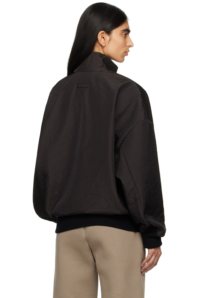 Padded crinkled polyester taffeta track jacket. 

· Loose-fit
· Stand collar
· Two-way zip closure
· Welt pockets
· Rib-knit hem and cuffs
· Dropped shoulders
· Rubberized logo patch at back collar
· Welt pocket at interior
· Full satin lining
· Logo-engraved black hardware

Part of the Eternal collection.

Supplier color: Black