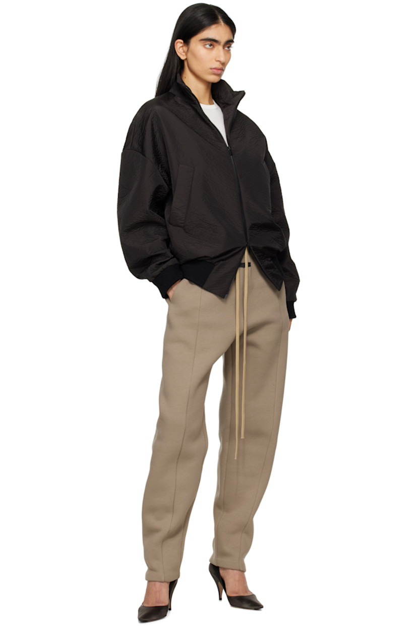 Padded crinkled polyester taffeta track jacket. 

· Loose-fit
· Stand collar
· Two-way zip closure
· Welt pockets
· Rib-knit hem and cuffs
· Dropped shoulders
· Rubberized logo patch at back collar
· Welt pocket at interior
· Full satin lining
· Logo-engraved black hardware

Part of the Eternal collection.

Supplier color: Black