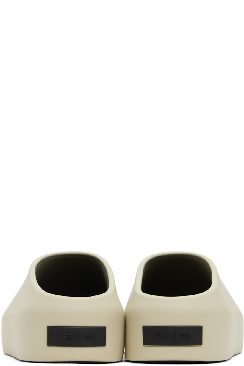 Foam rubber mules in taupe.

· Rubberized logo patch at heel
· Removable logo-embossed buffed leather insole
· Extrabounce foam rubber midsole
· Treaded XL Extralight® rubber outsole

Supplier color: Taupe