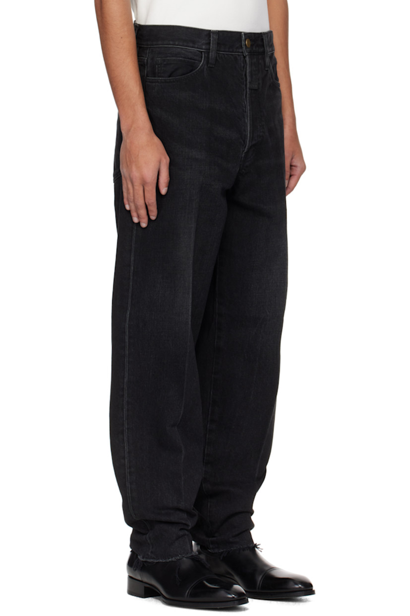 Tapered non-stretch denim jeans. Fading and whiskering throughout.

· Belt loops
· Five-pocket styling
· Button fly
· Rubberized logo patch at front
· Creased legs 
· Frayed edge at cuffs 
· Logo-engraved bronze-tone hardware

Supplier color: Black