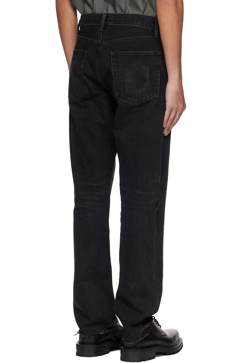 Straight-leg non-stretch denim jeans. Fading and whiskering throughout. 

· Belt loops
· Five-pocket styling
· Button fly
· Rubberized logo patch at front
· Frayed edge at cuffs 
· Logo-engraved bronze-tone hardware
· Contrast stitching in tan 

Supplier color: Black