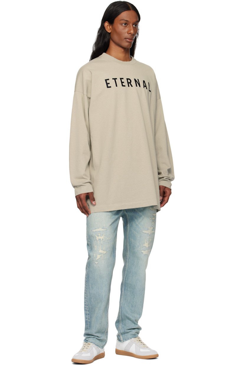 Straight-leg non-stretch denim jeans. Fading, hand-distressing, and topstitching throughout.

· Belt loops
· Five-pocket styling
· Logo patch at button fly
· Frayed edge at cuffs
· Contrast stitching in tan

Supplier color: Repaired medium indigo